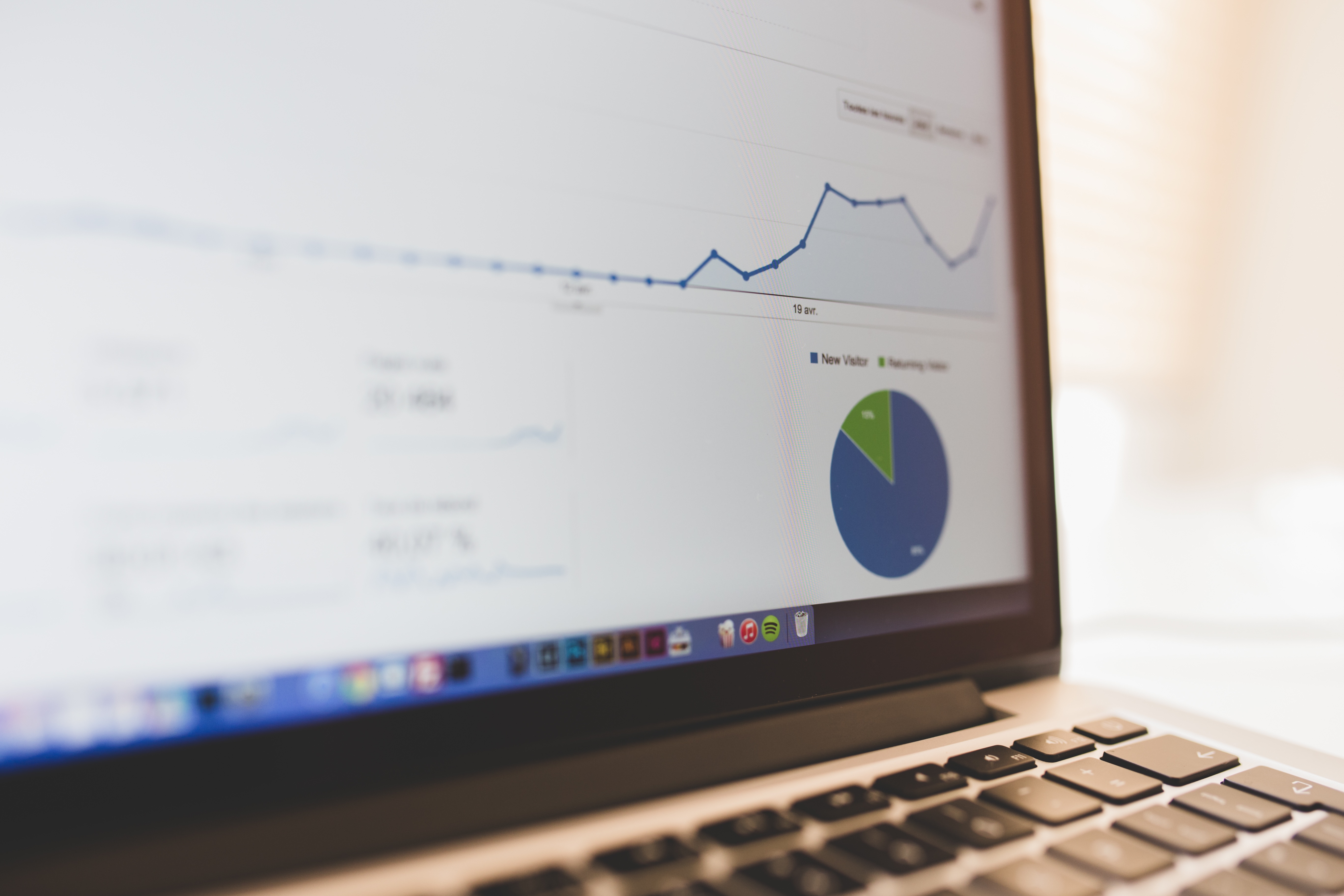 A laptop showing analytics graphs and dashboard charts, used here as a visual stand-in for a shared BI foundation